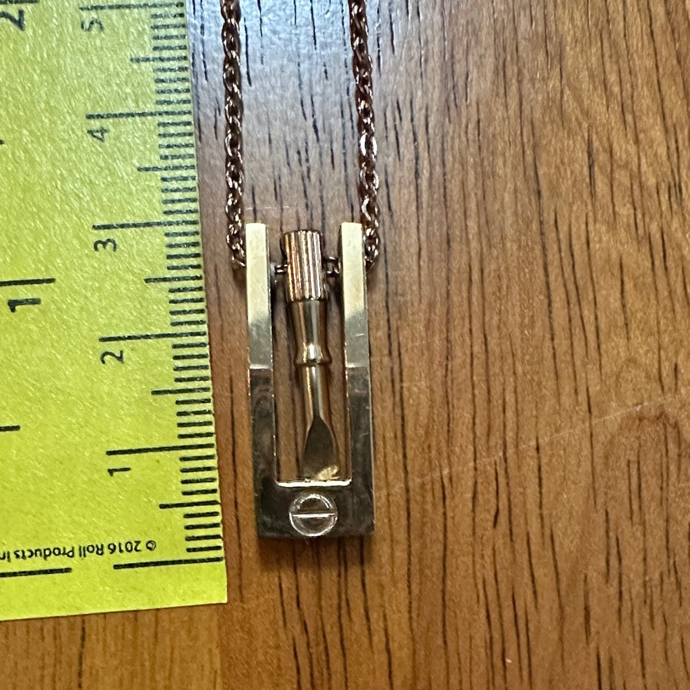 Gold Tone Screw and Screwdriver Pendant Necklace.